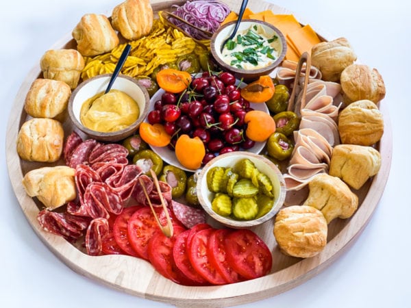 Summer Lunch Turkey Sandwich Board with toamtoes, rolls, turkey, and toppings