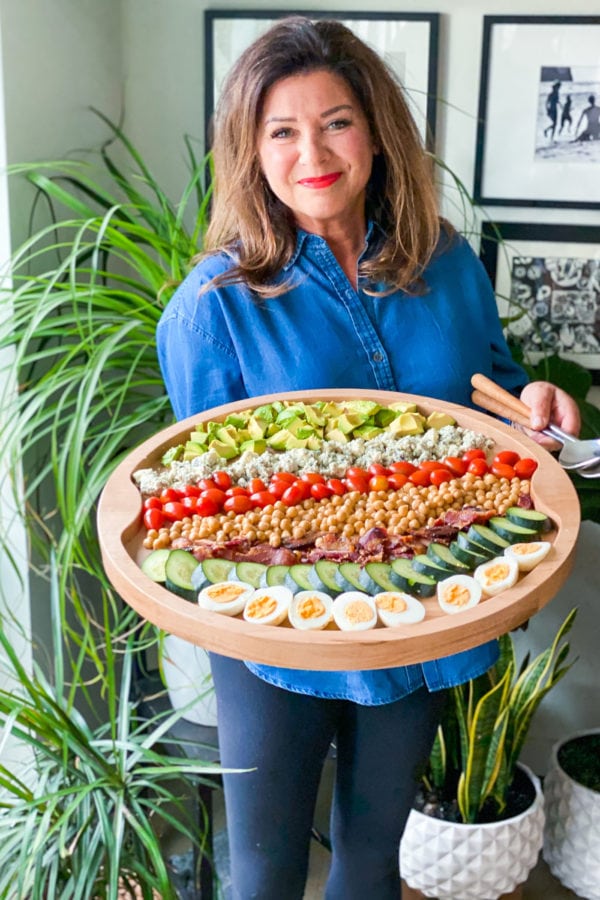 woman holding Chickpea Cobb Salad Board