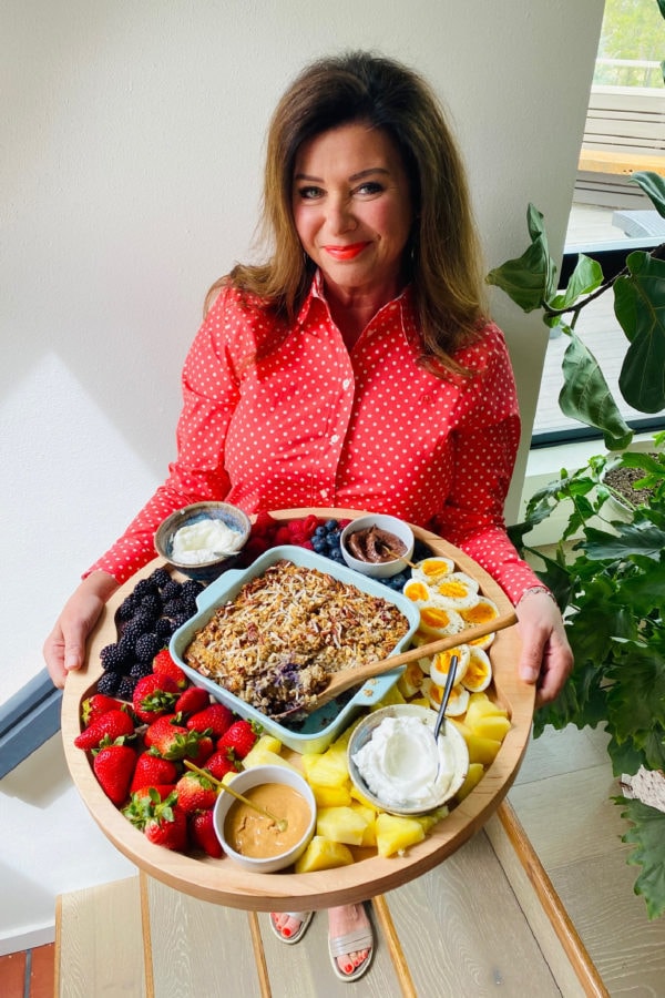 a woman holding a round Baked Oatmeal Breakfast Board