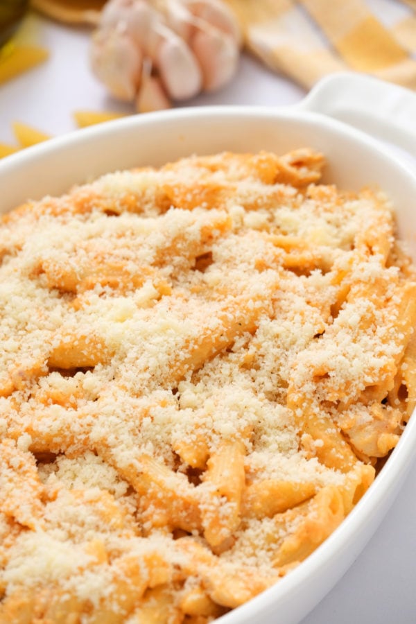 parmesan cheese on top of pasta bake