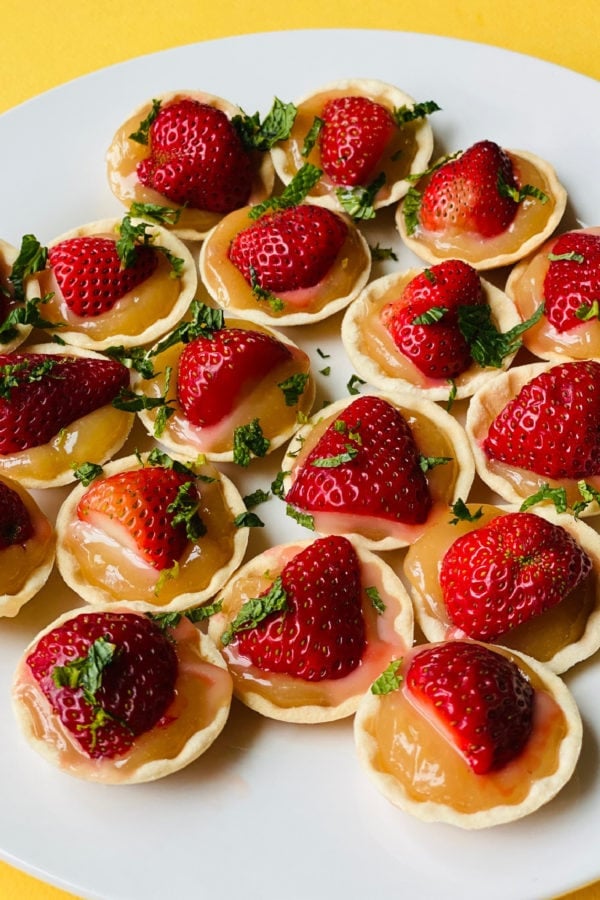 lemon tarts with strawberries and mint