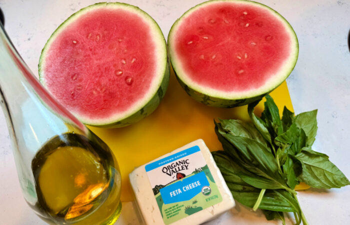 making Watermelon Feta Bites with basil