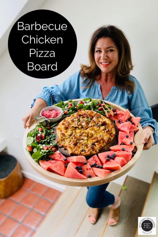 woman holding a Barbecue Chicken Pizza Board
