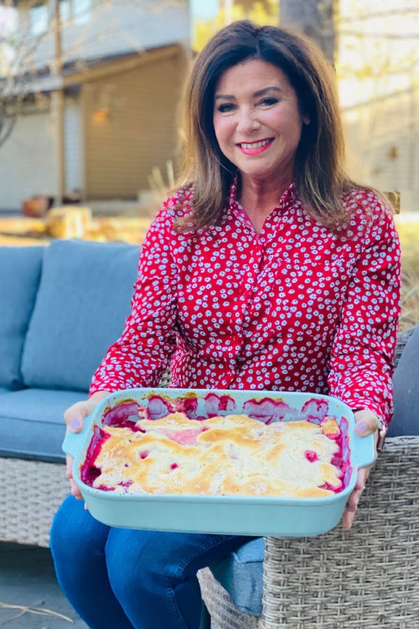 woman holding 9x13 pan Classic Raspberry Cobbler