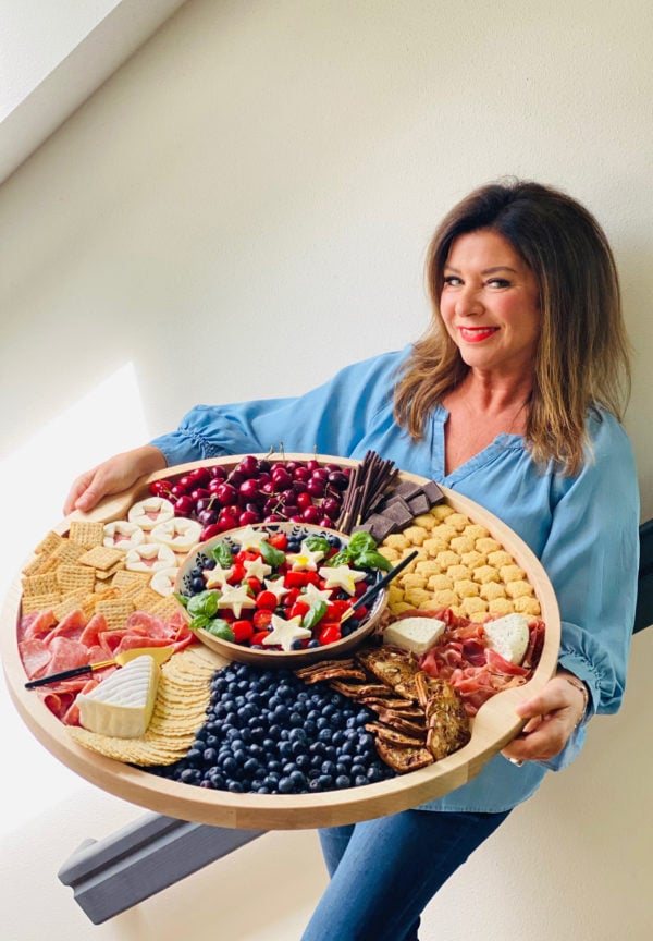 woman holding a Blueberry Patriotic Charcuterie Board