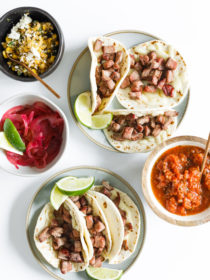 mini tacos on plates with toppings