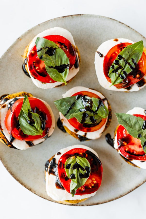 Grilled Polenta Caprese Appetizers on a plate