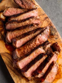 Miso Marinated New York Steak on wood platter