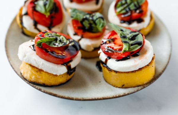 Grilled Polenta Caprese Appetizers on a plate