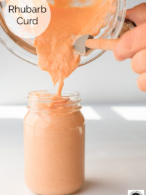 pouring rhubarb curd into a jar