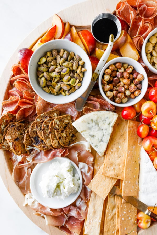 charcuterie board with cheese and nuts