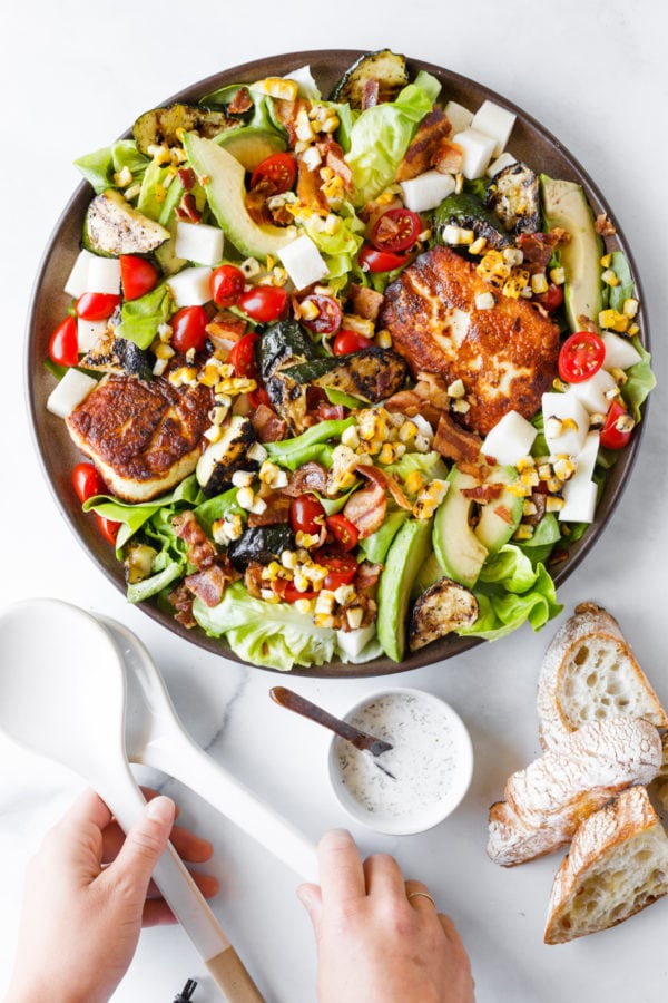 round serving dish of Halloumi Cheese and Grilled Corn Zucchini Salad
