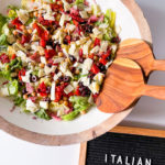 round wood serving bowl of Italian chopped salad