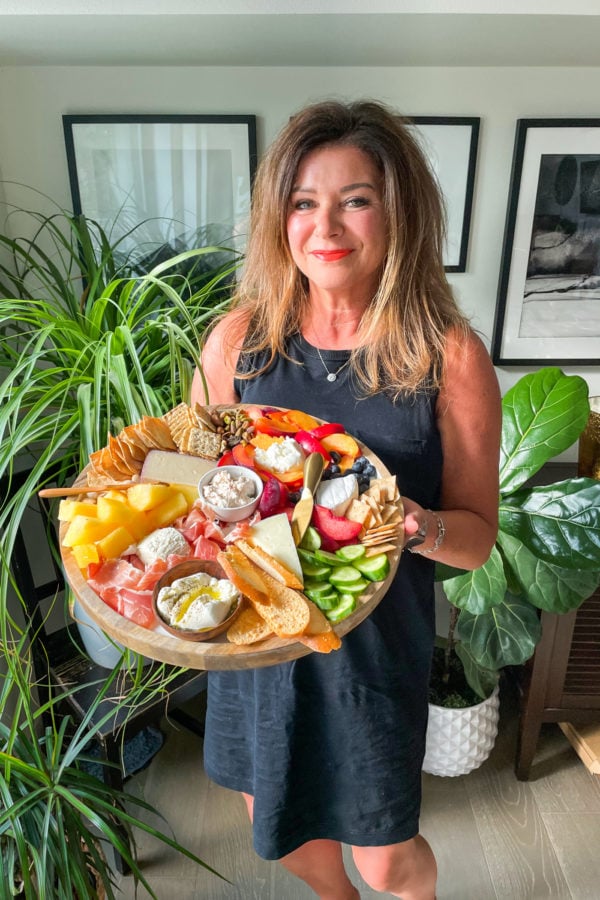 woman holding a Quick Summer Cheese Charcuterie