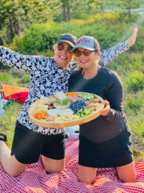 2 ladies with kayak board