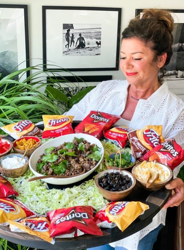 woman holding a Walking Taco Board