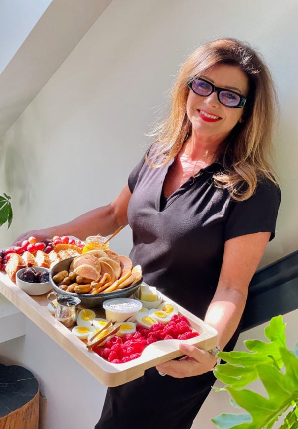 woman holding a rectangle pancake board