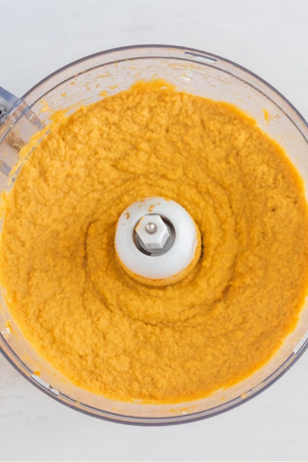 mixing pumpkin hummus