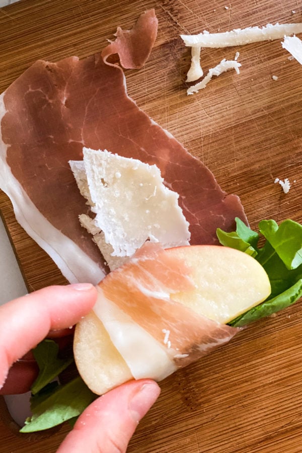 rolling a Prosciutto Wrapped Apple Bite