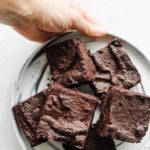 holding a plate of Mocha Orange Brownies