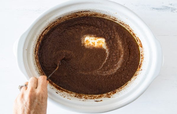 adding butter to Sweet Spiced Apple Butter