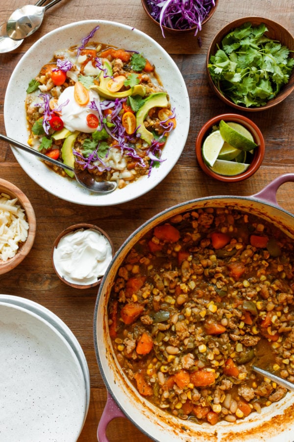 pot of Butternut Squash Hatch Green Chili with toppings