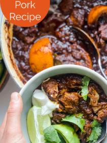 holding a bowl of Chile Braised Pork