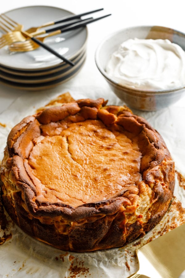 Butternut Squash Cheesecake on a plate, served with whipped cream