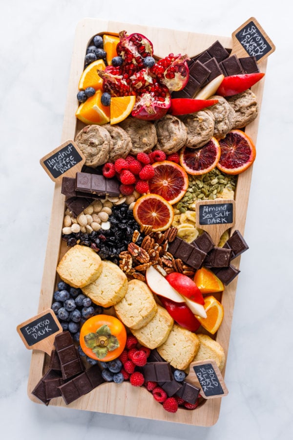 dessert board with fruit and chocolate bars