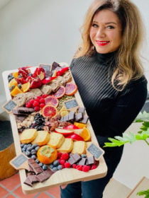 woman holding a chocolate board