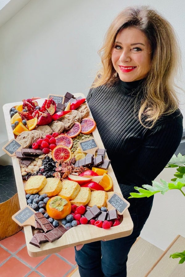 woman holding a chocolate board