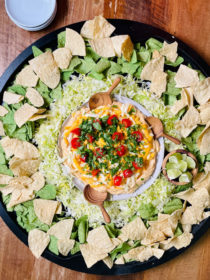 a large round Taco Dip Board