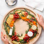 holding a Christmas Wreath Charcuterie Board