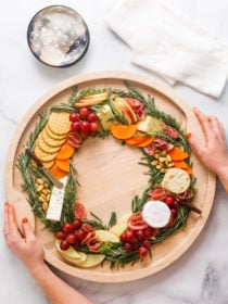 holding a Christmas Wreath Charcuterie Board