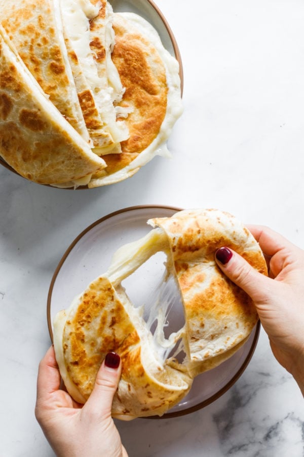 pulling apart a flatbread grilled cheese