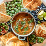 round board with sweet potato soup and flatbread grilled cheese