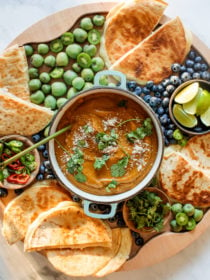 round board with sweet potato soup and flatbread grilled cheese