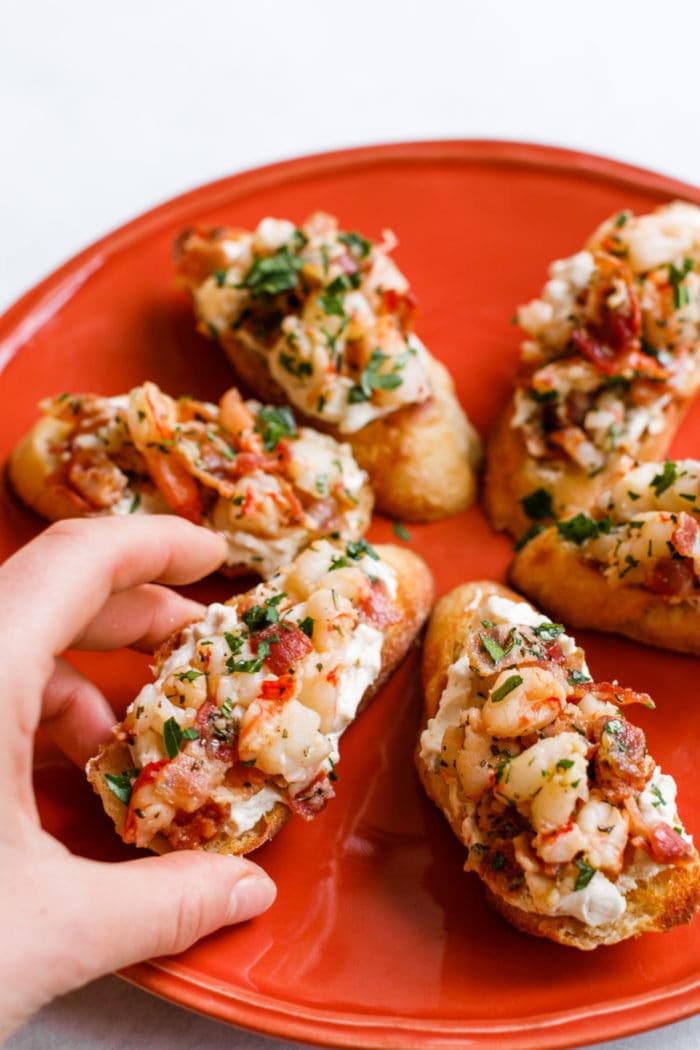 holding a Bacon Shrimp Toast