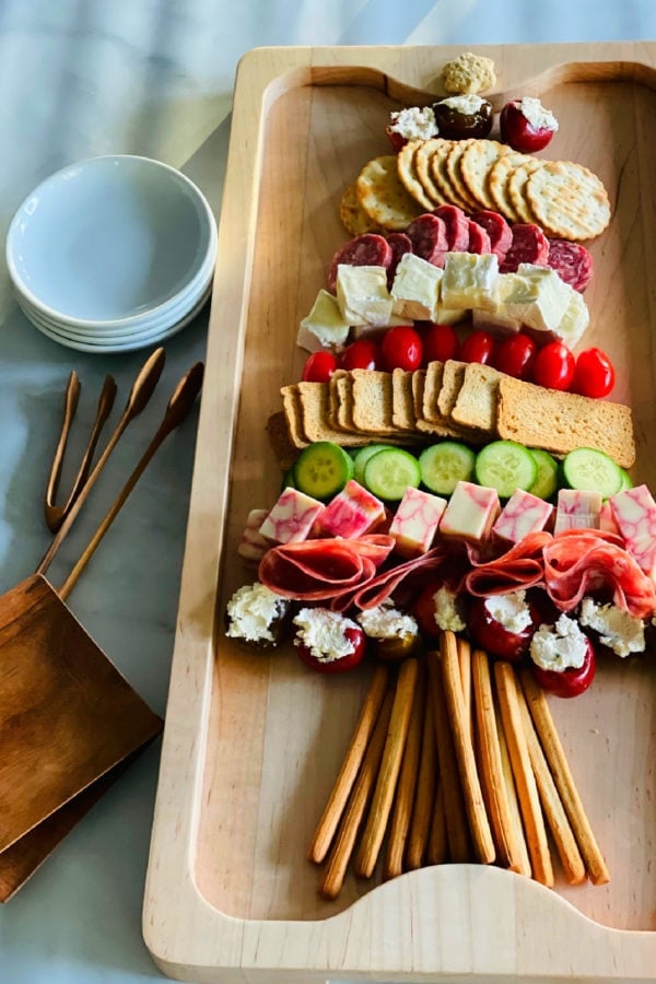 serving a Christmas Charcuterie Tree Board
