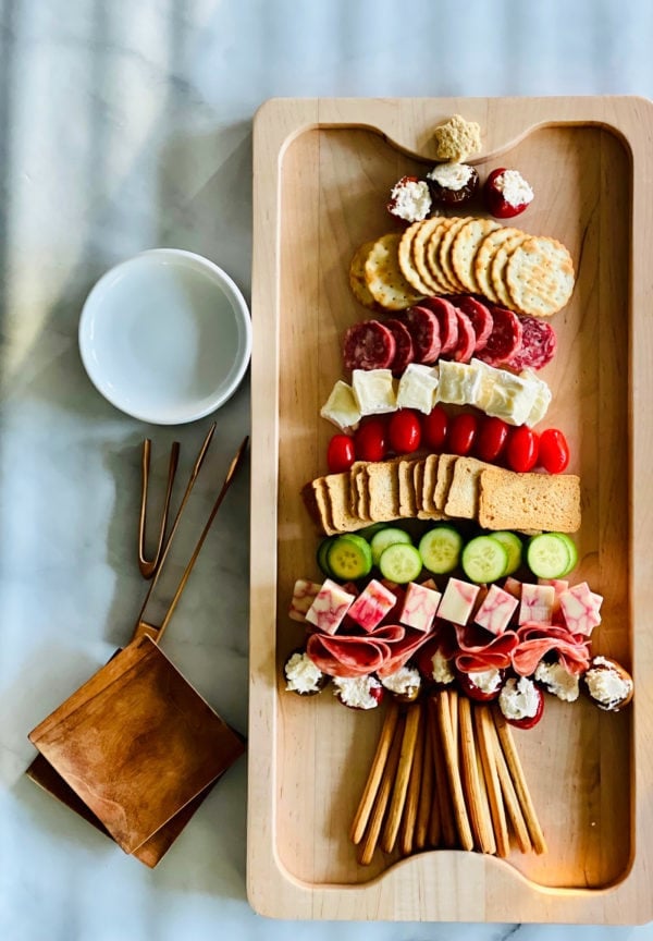 Christmas Charcuterie Tree Board with plates and tongs