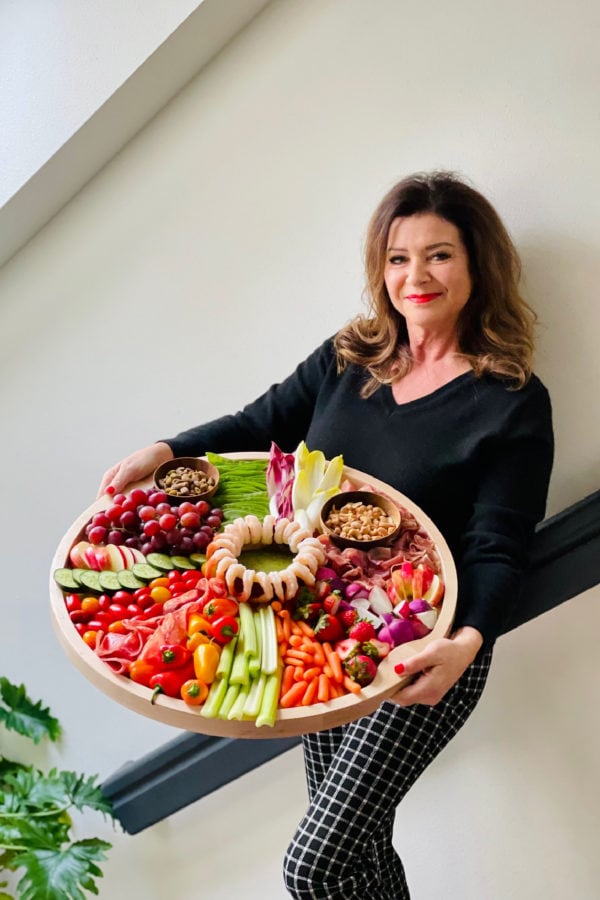 woman holding a Whole 30 Charcuterie Board