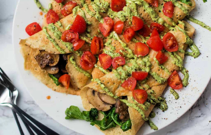 mushroom crepes garnished with tomatoes