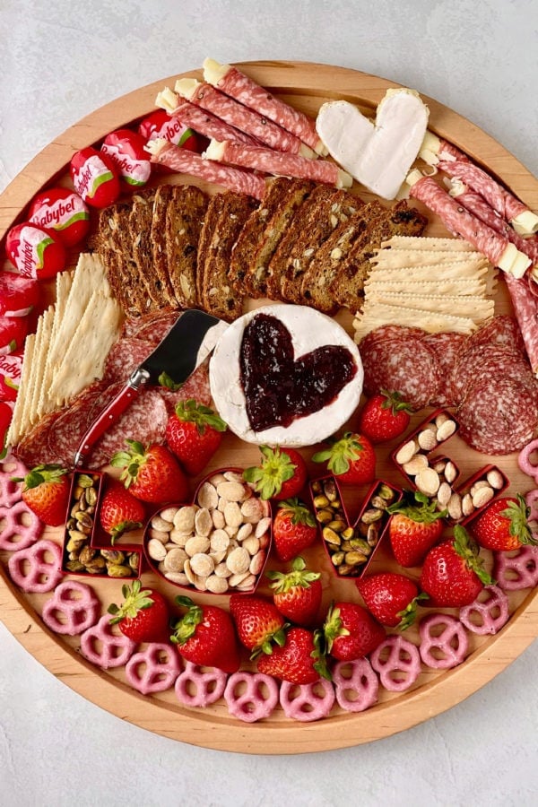 a round Brie-Filled Heart Charcuterie Board