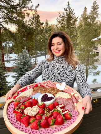 Brie-Filled Heart Charcuterie Board with sunset