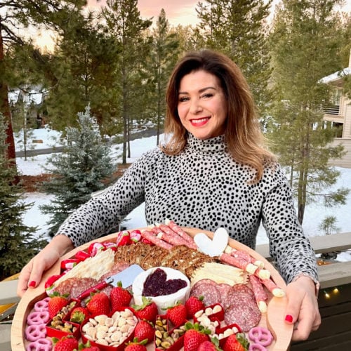 Brie-Filled Heart Charcuterie Board with sunset