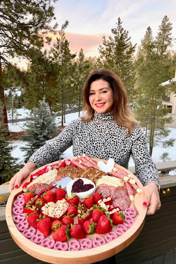 Brie-Filled Heart Charcuterie Board with sunset