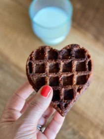 holding a Heart-Shaped Waffle Cookie with milk