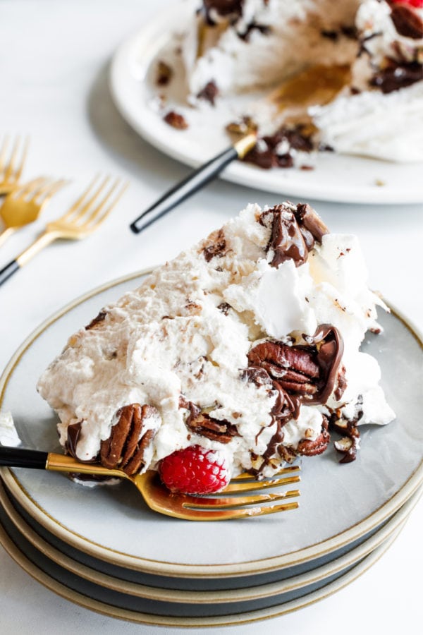 a slice of Maple Pecan Chocolate Pavlova