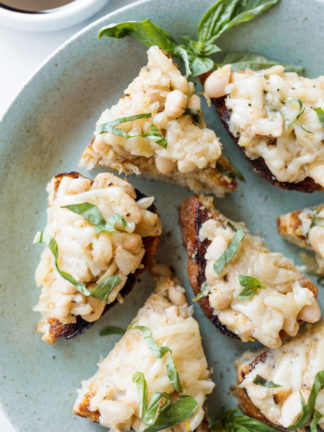 plate of white bean crostini toasts