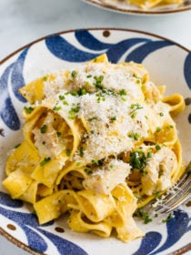 blue bowl of Creamy Lemon Chicken Pasta